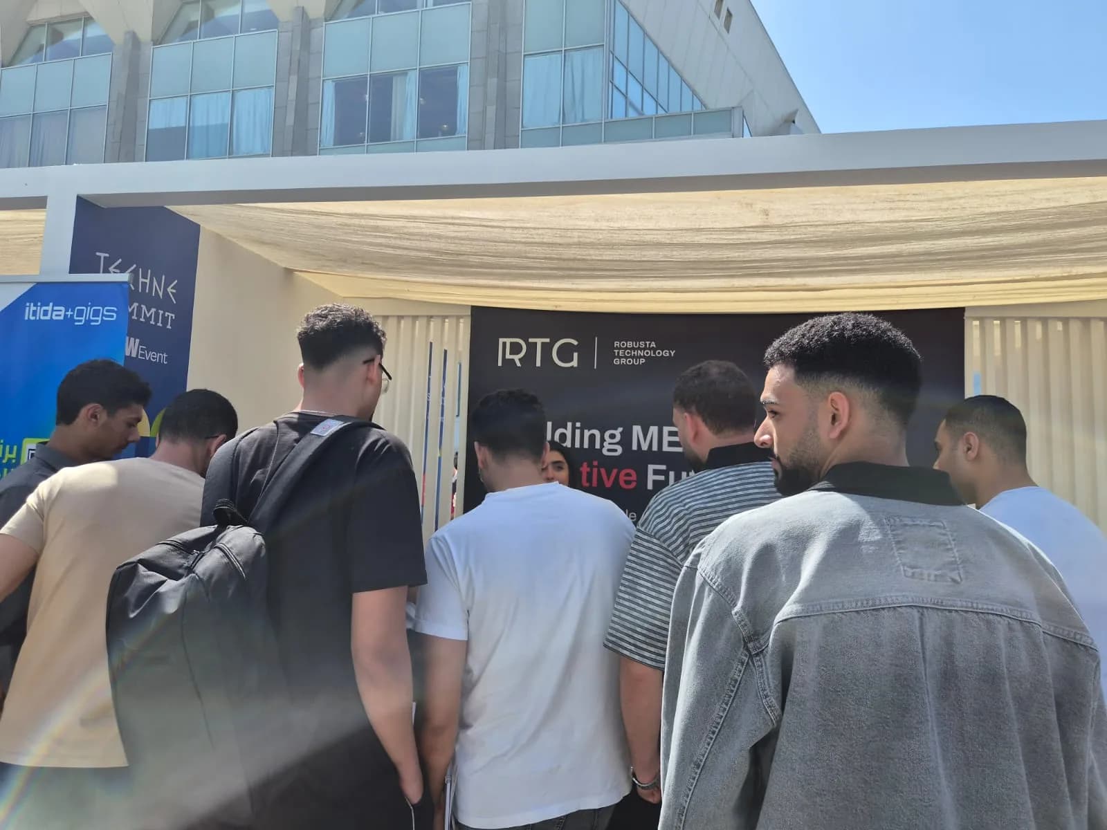Visitors gathering at the RTG booth at Techne Summit